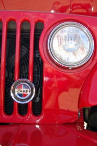 Front of red Jeep