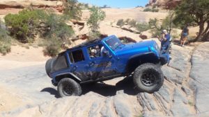 Blue Jeep off-roading