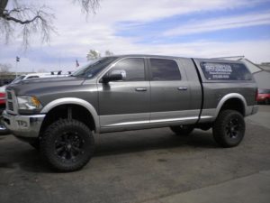 Grey Dodge Pick Up with cab topper
