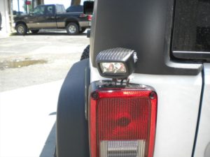 Tail light on a white Jeep