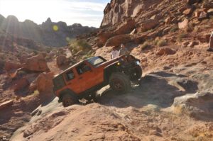 Orange Jeep off-roading