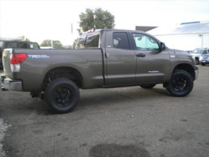 Grey-tan pick up truck