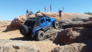 Blue Jeep off-roading