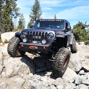 jeep driving off road over rocks